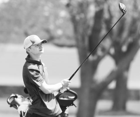 CENTURA’S Noles Christensen takes a shot on the eighteenth fairway during last Thursday’s LouPlatte Conference golf meet at Indianhead Golf Club in Grand Island. Photo by Michael Happ