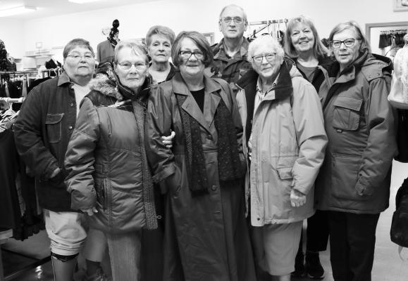 SEVERAL VOLUNTEERS with the Howard County Medical Center Auxiliary Thrift Shop tried on some of the local thrift shop’s coats ahead of the shop’s annual coat giveaway this Saturday. Pictured are (back row): Pam Switzer, Linda Vargason, John Keller, Carol Leth, and Loraine Lawler; and (front row): Jackie Cook, Ruthie Jacobsen, and Theda Van Horn. Photo by Michael Rother