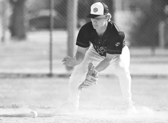 ST. PAUL/PALMER’S MASON MAJERUS makes a play at shortstop during the Cats’ game against Seward on Saturday at Grover Cleveland Alexander Field in St. Paul. Photos by Michael Happ
