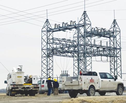 CREWS with the Howard Greeley Rural Public Power District were on site at the substation north of St. Paul on Monday morning. The prior week, an oil circuit recloser had failed at the substation, causing a power outage to the City of St. Paul and points north. Photo by Michael Happ
