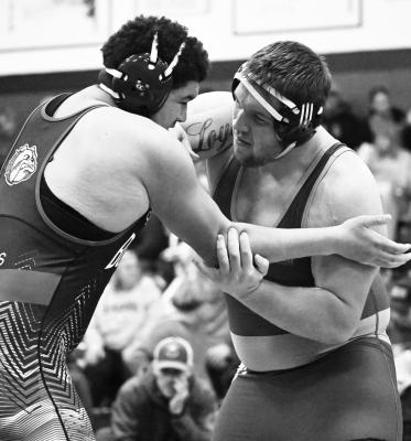 CENTURA’S Kolten Simons works to take down Shelton’s Demarion Williams on Friday afternoon during the semifinals of the Ravenna Invite. Photo by Michael Happ