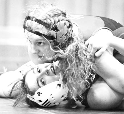 ST. PAUL’S ALEXIS GALUSHA works to pin Centura’s Cambree Plate during the first dual of last Thursday night’s quadrangular at St. Paul High School. Galusha won the match in the second period. Photos by Michael Happ