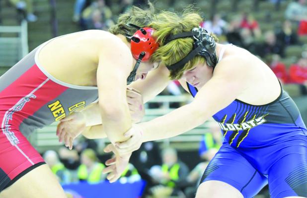 JACK KASLON went head-to-head with Bishop Neumann’s Trent Moudry during the first round of the NSAA State Wrestling Championships in Omaha last week. Kaslon ended up being pinned by the Cavalier.
