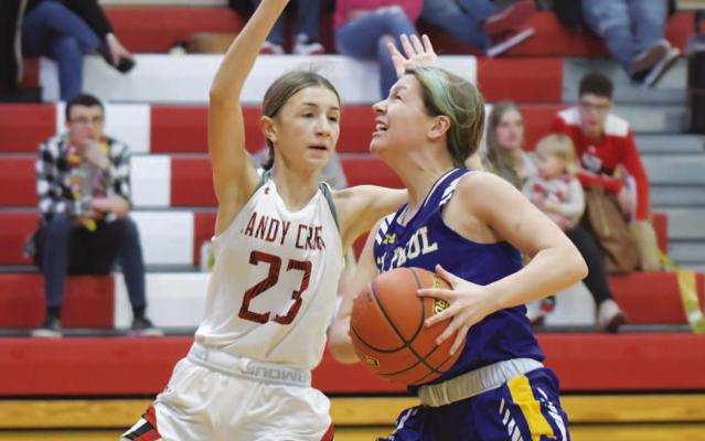 KAYLEY WELLS sprints down the court towards the basket after she picked up one of her two steals during last week’s game against Sandy Creek. Wells had two points in the game. (Michael Happ)