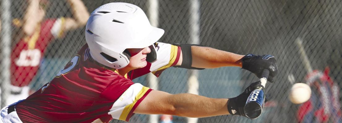 DCB’S LUKE JOHNSON lays down a bunt during last Tuesday’s game between DCB and St. Paul. Photo by Michael Happ
