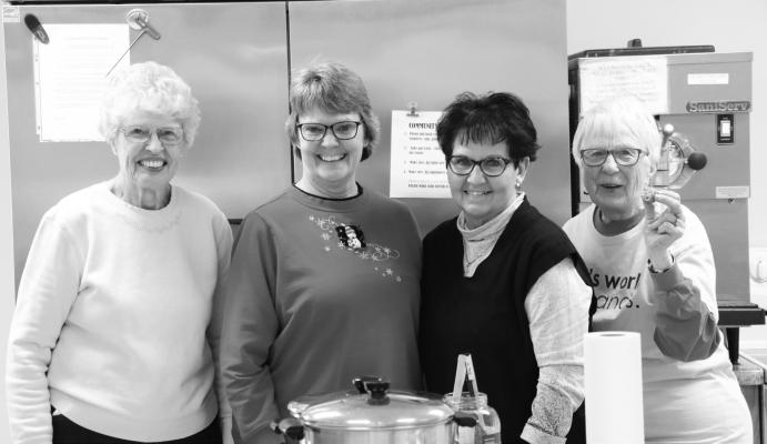 LENDING A HAND during the Brats &amp; Spirits fundraiser at the Wolbach Community Center on Saturday were Lola Teter, Lori Dilsaver, Sherri Oakley, and Donna Rother. Photo by Michael Rother