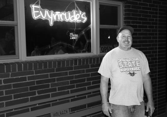 EVYNRUDE’S Owner/Operator Jess Rother stands in front of the Center Avenue bar in downtown Wolbach. The bar officially opened for business on October 10th. Photo by Michael Rother