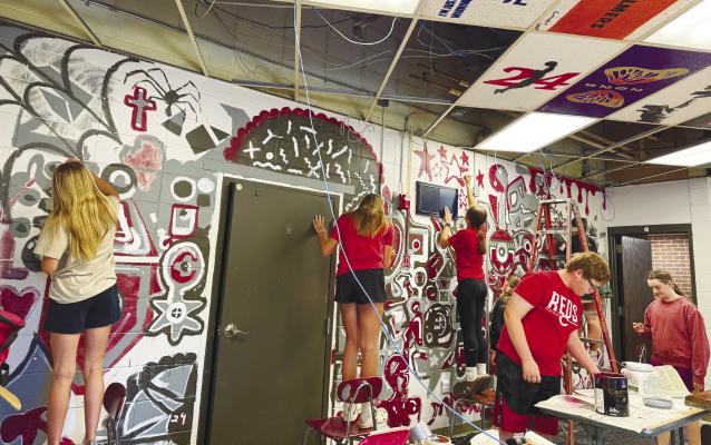 THE REMOVAL OF A WALL that divides Centura’s two adjoining art rooms created the perfect canvas for Centura art students to paint a mural on this spring. The project gave sixth-through-eleventh graders in the district a chance to flex their imaginations in the world of abstract art. Courtesy Photos