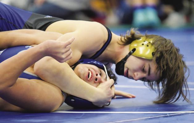 ST. PAUL freshman Alex Meinecke punched his ticket to the finals of the LouPlatte Conference Wrestling Tournament on Saturday with a second period victory over Gibbon’s Rogelio Hernandez. Meinecke was one of three Wildcats to earn individual conference titles at last week’s meet. (Michael Happ)