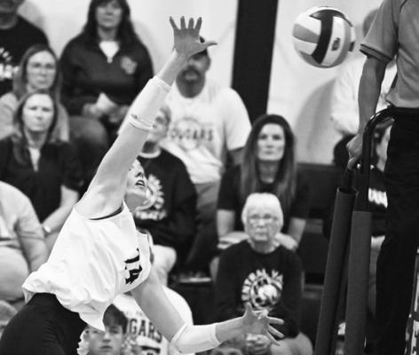 CAYLE GROSSART goes for a kill during Thursday’s match against Nebraska Christian. Photo by Michael Happ