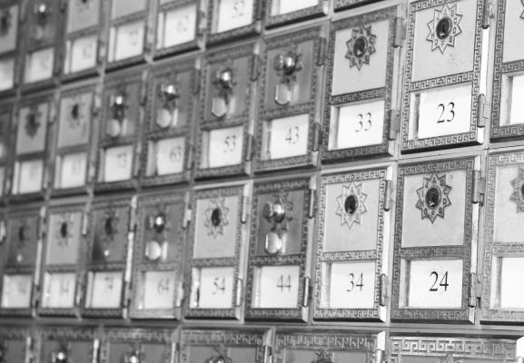 THE COMBINATION LOCK post office boxes at the post office in Wolbach are being transitioned to key-lock boxes as a part of an initiative by the postal service to phase out combination boxes. Photo by Michael Rother