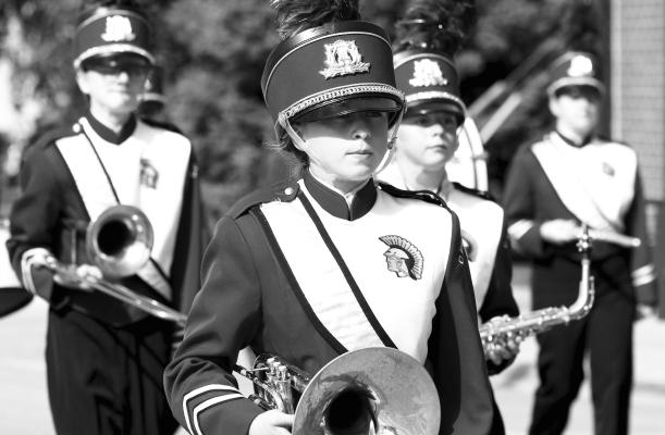 MIDDLE AND HIGH SCHOOL MARCHING BANDS— including the Centura High School Marching Band—from across the state joined the University of Nebraska at Kearney on Saturday for the sixty-sixth annual UNK Band Day Parade. Above, members of the Centura Marching Band make their way through the streets of Kearney. The event brought a total of thirty-seven bands to downtown Kearney on Saturday. UNK Communications