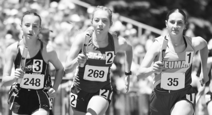 NATALIE POSS races away from the start of the girls’ 4x800-meter relay on Friday afternoon. The Wildcats’ team of Poss, Kamden Sack, Kassidy Hymer, and Charlie Wegner placed ninth in that event. Photos by Michael Happ
