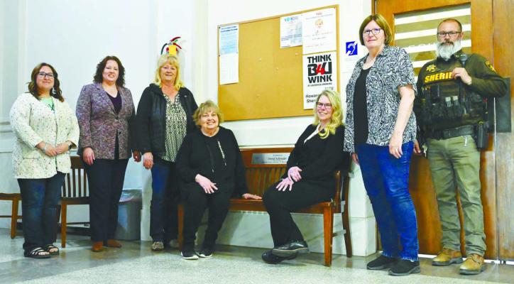 HOWARD COUNTY OFFICIALS joined the Schroeder family, including Dave’s wife Pat, for last Friday’s bench dedication at the county courthouse. Pictured during the event are County Treasurer Sara Roy, County Attorney Heather Sikyta, Howard County Board of Commissioners Chairman Kathy Hirschman, Pat Schroeder, Clerk of the District Court Lisa Johnson, Howard County Clerk Brenda Klanecky, and Howard County Sheriff Mike Hoff. Photos by Michael Happ