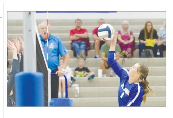 ST. PAUL’S KATIE OAKLEY goes for a kill from the right pin during last week’s match against Centura. The Wildcats ended up sweeping the Centurions last Tuesday. Photos by Michael Happ