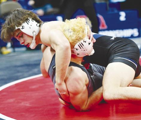 ALEX MEINECKE attempts to pin Crofton/Bloomfield’s Wyatt Tramp during the Class C 175-pound championship match on Saturday afternoon in Omaha. Photos by Michael Happ