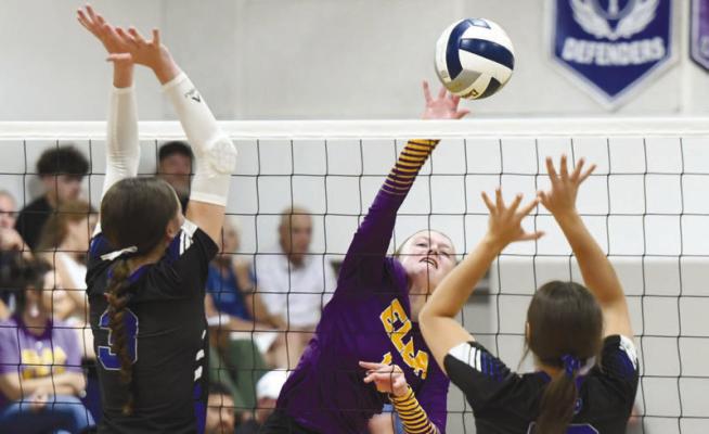 CHELSI MCKOSKI goes for a kill against Nebraska Christian’s defense during last week’s triangular with the Eagles and Gibbon. Elba beat Gibbon and took a set from Nebraska Christian. Photos by Jordan Coslor