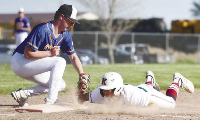 BRAXTON HEATER attempts to pick off Central City/Centura’s Fletcher Fries at first base during last Tuesday afternoon’s game between the Cats and the Kernels. Photos by Jordan Coslor