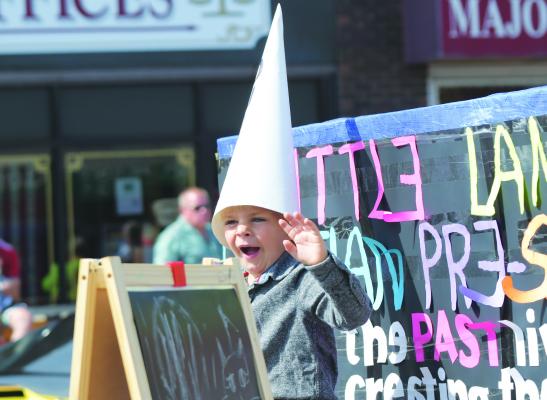 HUNTER HELMER had a smile on his face as he waved to the crowd from atop the Little Lambs Christian Preschool float in Saturday’s GCA Days Parade. Little Lambs finished as the runners-up in the float division. Michael Happ