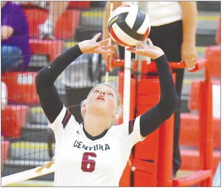 KASSIDY HURT sets the ball during Centura’s match with Doniphan-Trumbull last Tuesday night in Loup City. The Cardinals topped the Centurions 2-0. Photos by Michael Happ