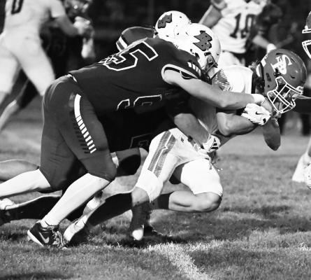 ZANDYN WELLER attempts to gain a few extra yards by moving the pile on Friday night. Weller led the Wildcats’ offense opposite the Indians, who dealt St. Paul its third loss of the season. Photos by Michael Happ