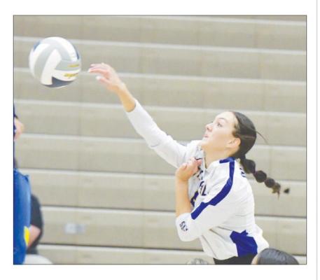 MACY PORTER takes a shot from the right pin last Thursday night. Porter finished the match against Sutton with four kills. Photo by Michael Happ