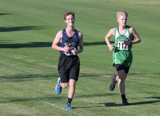 AIDAN ANDERSON was all smiles as he battled down the backstretch of the course at last Friday’s Boone Central Invite in Albion. Anderson finished the race in sixty-fifth. (Michael Happ)