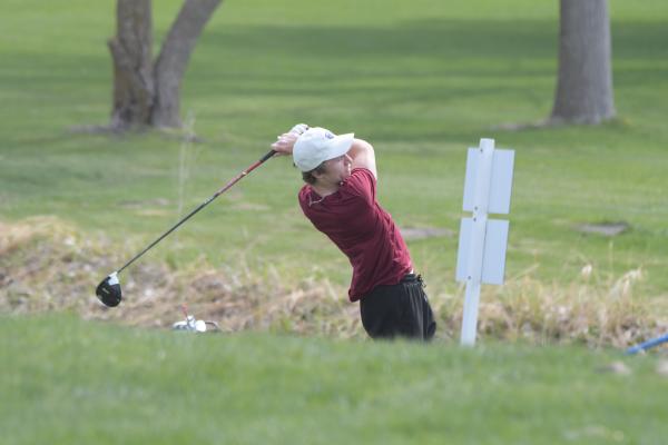 EASTON BRAND tees off on the seventh hole of the St. Paul Country Club on Monday morning. Brand led the Centurions after he shot a ninety-six. (Michael Happ)