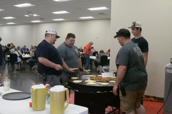 Working the griddle during Sunday morning’s pancake fundraiser at the St. Paul Civic Center were Tyler Moslander, Devan Wilkins, Thomas Mrkvicka, and Kyle Woodgate. (Michael Happ)