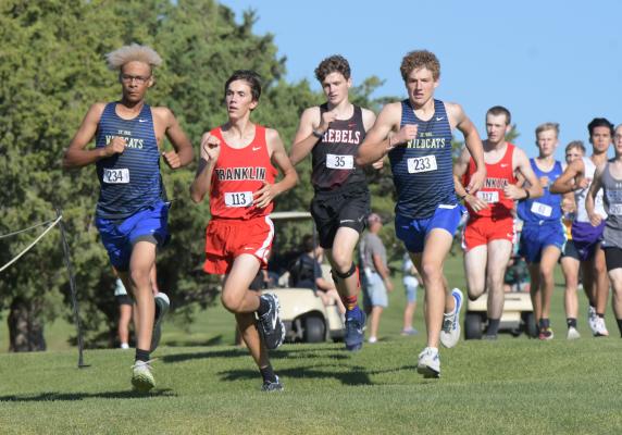 ST. PAUL’S Christopher Thomas and Jack Thede jockeyed for position at the front of the pack during last week’s Ron Priebe Invite hosted by Gibbon. The two Wildcats both netted hardware at the meet to lead St. Paul. (Michael Happ)
