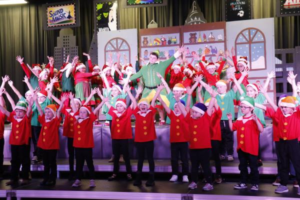 BUDDY THE ELF (Colter Goodrich) joins his elf friends (Central Valley kindergarten-through-third-graders) in a rendition of “Happy All The Time” at the North Pole during the school’s Thursday night performance of Elf Jr. the Musical. (Michael Rother)
