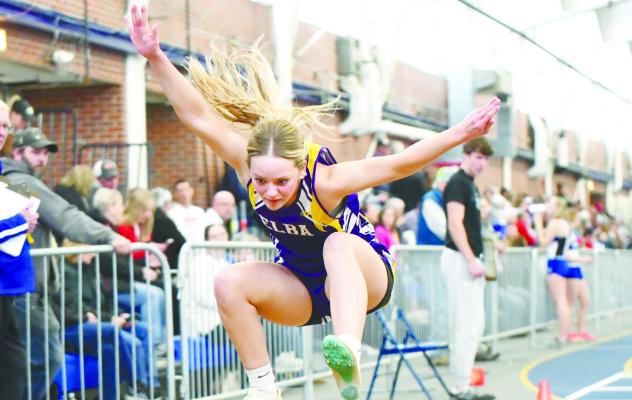 ELBA’S ADDISON WYSOCKI landed at 31-07.5 to place fourth in the girls’ triple jump at last week’s University of Nebraska at Kearney Indoor Invite. Wysocki was part of an Elba team that had a strong showing at the Lopers’ annual indoor prep meet last Thursday. Photo by Jordan Coslor