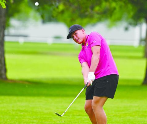 SAWYER KAVAN chips on to the second green at Indianhead Golf Club during the junior’s final round at the state golf tournament. Photo by Michael Happ