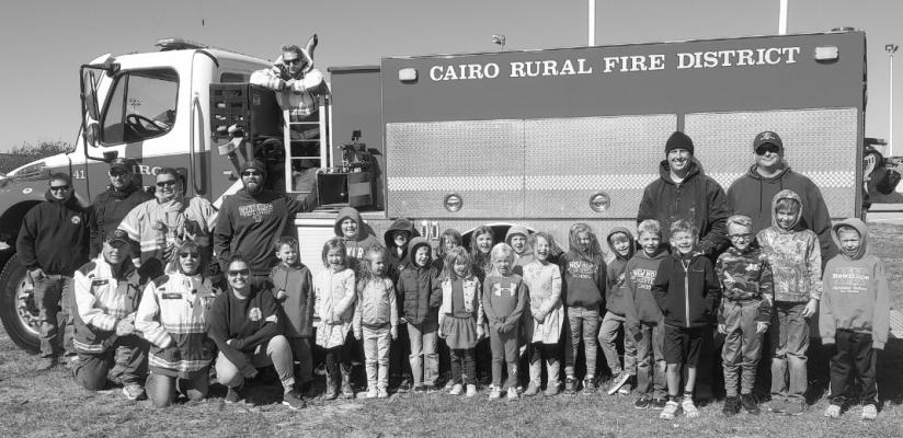THE BOELUS, DANNEBROG, AND CAIRO FIRE DEPARTMENTS visited Centura Public Schools and New Hope School on Thursday, October 13, 2022. Centurion preschoolers through fifth-graders participated. Fire personnel included, front row, Bob Carrol, Joan Kapustka, and Emily Paczosa; back row, Nate Blomquist, Garrett Teichmeier, Devin Wilkinson, Chris Donahoo, Aaron Andersen, and Scott Sorensen. The children pictured are from New Hope Christian School. (Courtesy Photo)