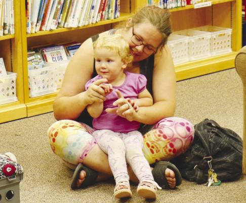 FAMILY STORYTIME brought out a big crowd of children five years old and under to the St. Paul Library, where participants sang songs, made a craft, and enjoyed a good book.