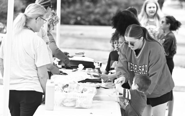 HOWARD COUNTY MEDICAL CENTER in St. Paul served diners of all ages at the medical center’s seventy-fifth anniversary barbecue last Wednesday afternoon. A sizeable crowd attended the event, which was graced with beautiful weather. Photo by Michael Happ
