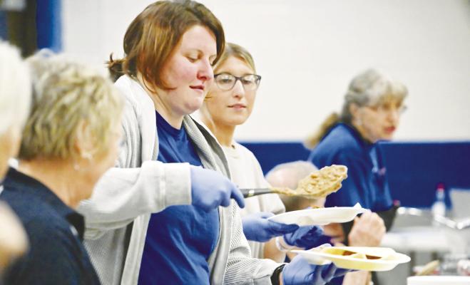 ROTARIANS Jordan Robinson and Keely Huebner helped serve up all the trimmings during the Rotary Club of St. Paul’s Taco Night fundraiser at the St. Paul school on January 21st. This year’s event raised around $800, according to preliminary numbers. Photos by Michael Happ