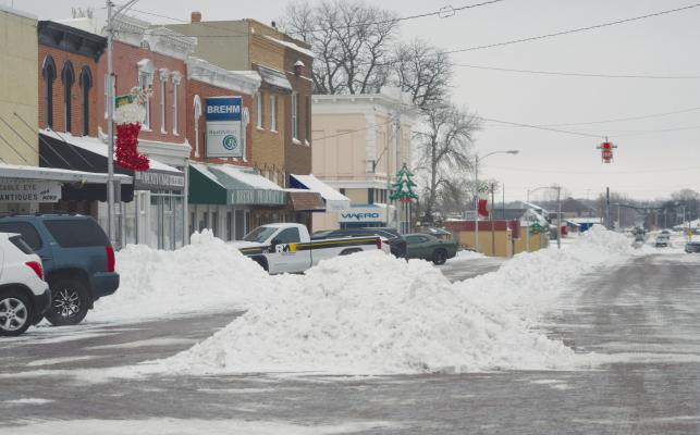 SNOW was piled high in downtown St. Paul on Tuesday, December 26th as city crews, business owners, and local residents worked to dig themselves out following the first major winter storm of the season. Photos by Michael Happ