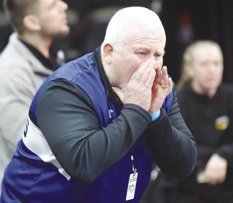 ST. PAUL GIRLS WRESTLING COACH JIM POTTER provides some input from the coaches’ corner during one of Gracie Ackles’ matches at this month’s NSAA State Wrestling Championships in Omaha. Photo by Michael Happ