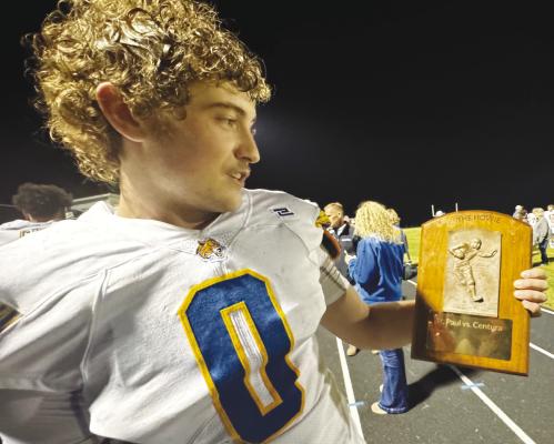 GAGE SACK, a senior at St. Paul High School, shows off The Howie on Friday night following St. Paul’s victory over Centura. Photo by Michael Happ