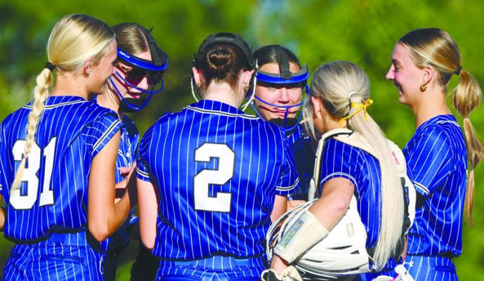 MEMBERS of the St. Paul softball team were all smiles as they entered the bottom half of the first inning against Centennial with a one-run lead on Thursday. St. Paul ultimately lost that game 13-5. Photos by Michael Happ