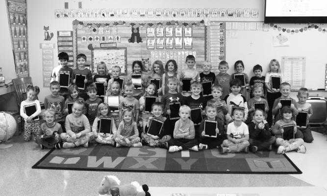 KINDERGARTEN students at St. Paul Elementary School recently received new classroom iPads thanks to the support of the St. Paul Education Foundation. The kindergarteners are pictured above with the new iPads. Courtesy Photo