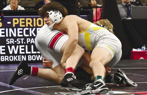 ST. PAUL’S ALEX MEINECKE works to take down Cobe Wells of Broken Bow during the championship match at 175 pounds during last week’s NSAA Class C State Wrestling Tournament in Omaha. Meinecke won the match and his second straight state title by a 13-3 major decision. Photos by Michael Happ