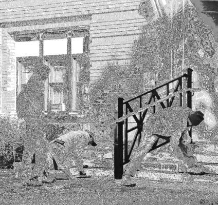 CREWS with Mid-Continental Restoration Co. were working on the courthouse steps last week. Photos by Michael Rother