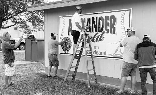 CREWS with the City of St. Paul hung a new welcome sign at Grover Cleveland Alexander Field last Thursday. The sign replaces an older sign that had reached the end of its lifespan. The new sign was installed in time for the American Legion Area C-6 Seniors Baseball Tournament, which will begin in St. Paul on Friday. Helping install the sign were Randy Jerabek, Jeremy Gorecki, Trevor Kowalski, Trae Anderson, Dillon Paczosa, and Matt Helzer (not pictured). Photo by Michael Happ
