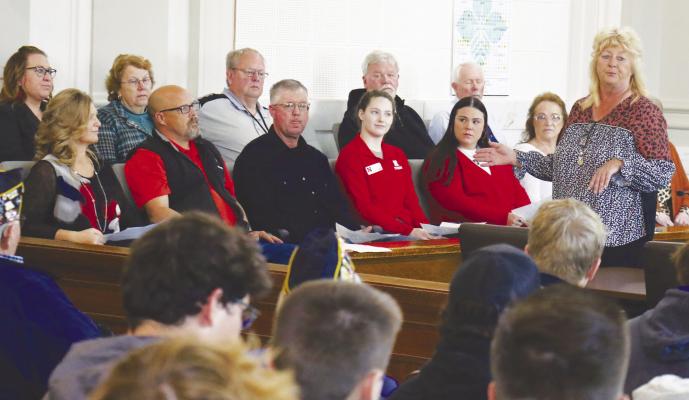 HOWARD COUNTY OFFICIALS, including Howard County Board of Commissioners Chairman Kathy Hirschman, at right, spoke to students during County Government Day at the Howard County Courthouse on Monday. Photos by Michael Rother