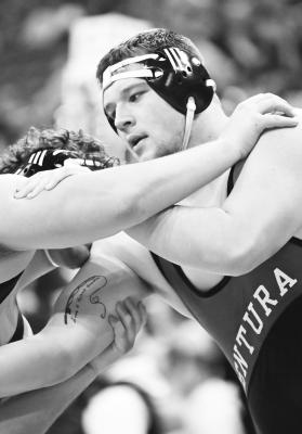 KOLTEN SIMONS opened the NSAA State Wrestling Championship with a match against Doniphan-Trumbull’s Tycen Breckner on Thursday afternoon. Photo by Michael Happ