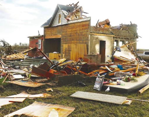 CHAD JACOBSEN’S rural Elba home was nearly completely destroyed after it was struck by an EF3 tornado on Friday, April 26th. Severe storms plowed through much of the area, state on Arbor Day. Photos by Michael Rother