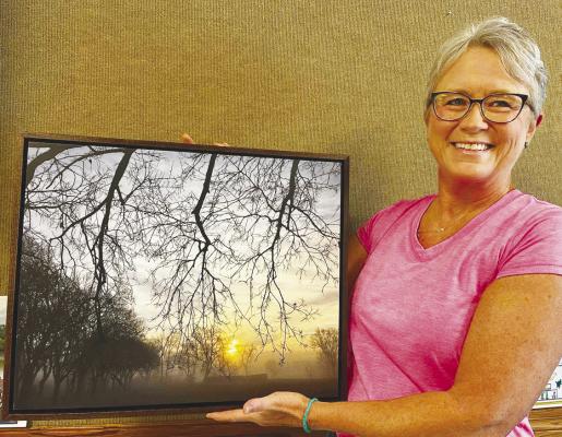 CHERYL ALBRIGHT of Ravenna is pictured with the winning photo in the Lower Loup Natural Resources District’s annual photo contest. Courtesy Photos