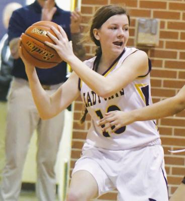 JAIME WYSOCKI attempts to dodge a Cardinal defender while driving the baseline during the second half of last week’s game against Harvard.